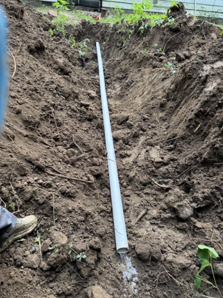 Call Hometown Flow Plumbing for sewer and plumbing service in Richards, MO PVC sewer line in an excavated trench for plumbing repair in Vernon County, Missouri